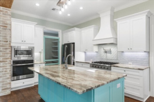 custom built home by eNg Designs & Construction in Hammond LA, kitchen that has coastal blue cabinets and beachy color theme