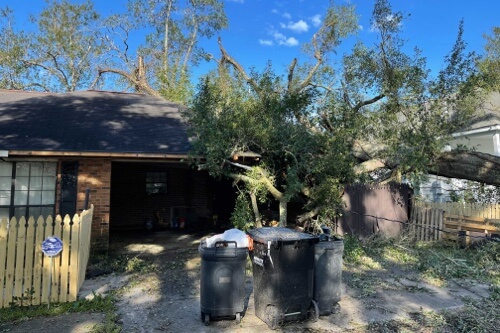Image of fallen tree on home in Southeast Louisiana after hurricane Ida in 2021